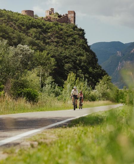 Two people on a bike path